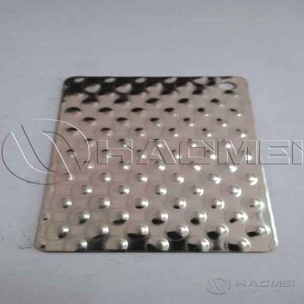 Lentil-shaped aluminum tread plate.jpg